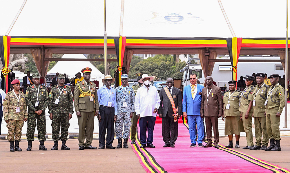 President Museveni shares a photo moment with some of the officers and people who were awarded medal during the NRM Liberation day celebrations at Kololo on Monday. (PPU Photo)