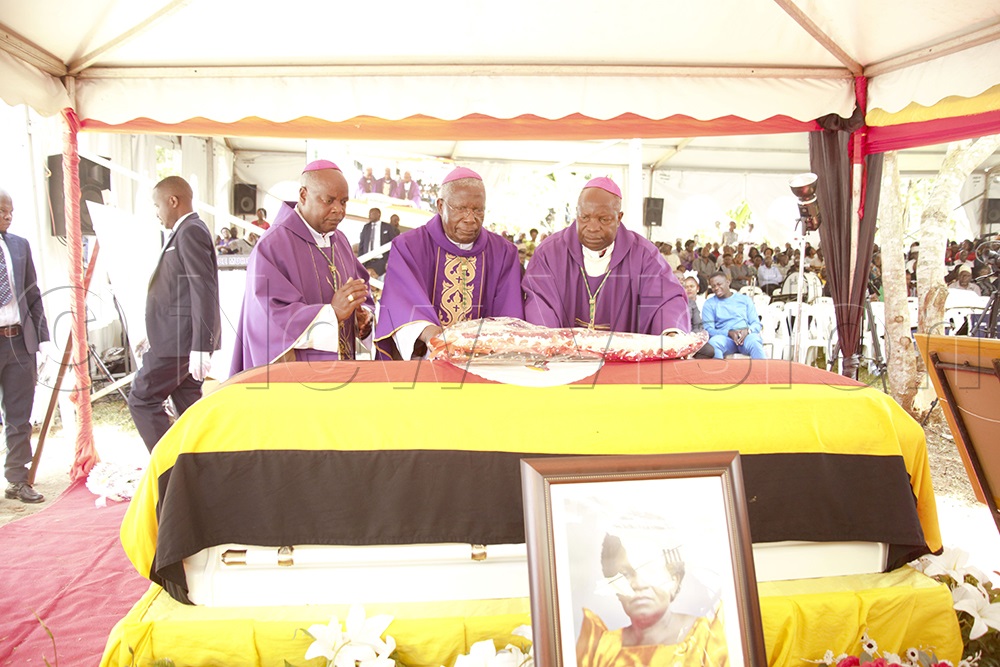 Bishops laying a wreath on the casket containing the remains of Bitamazire. (Photo by Simon Ssekidde)