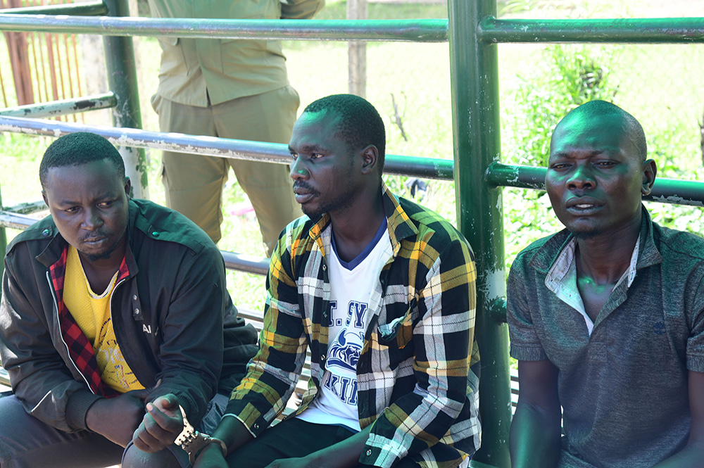 Emmanuel Okello alias Imorning (L) and Rashid Eyamu alias Odekuro (R) who are alleged to have masterminded the deal and Simon Epeu alias Iboda who pulled the lady out of the car. (Credit: Police)