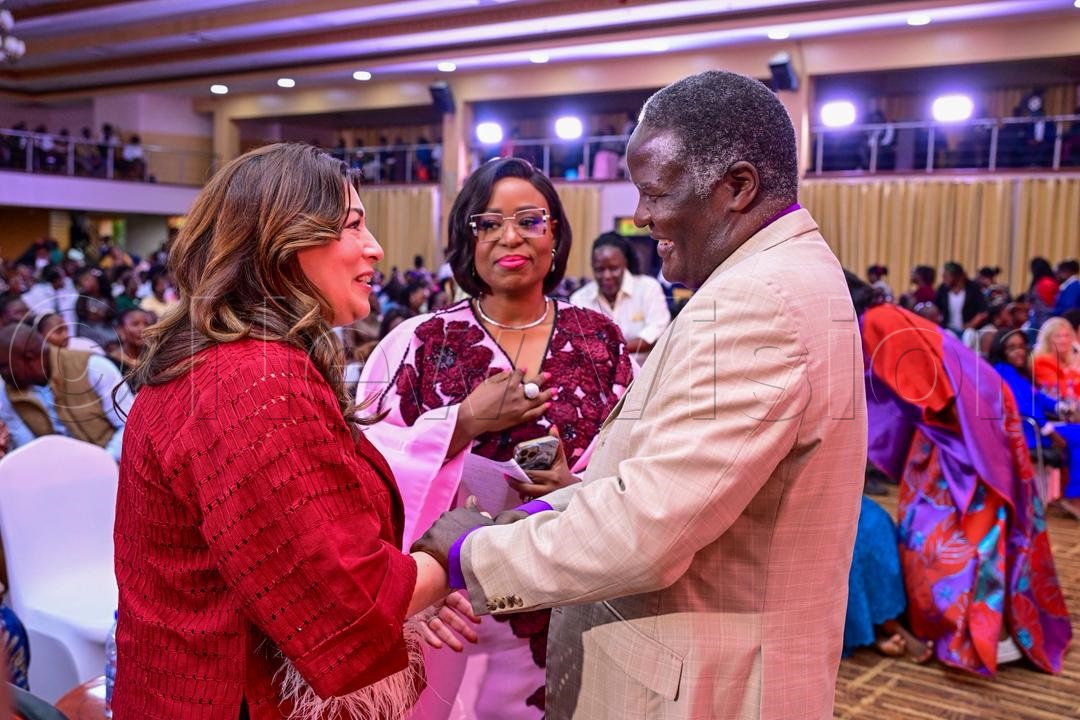 Bishop Joshua Lwere (right) sharing a light moment at the conference.