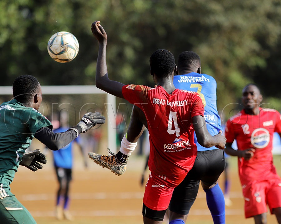 ISBAT University's Jordan Chandia (4) challenge's  Nkumba's Ashraf Musisi (3) during the UFL game in Nkumba on Friday
