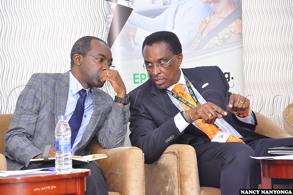 From left, education ministry spokesperson Dennis Mugimba and works & transport ministry commissioner Winstone Katushabe