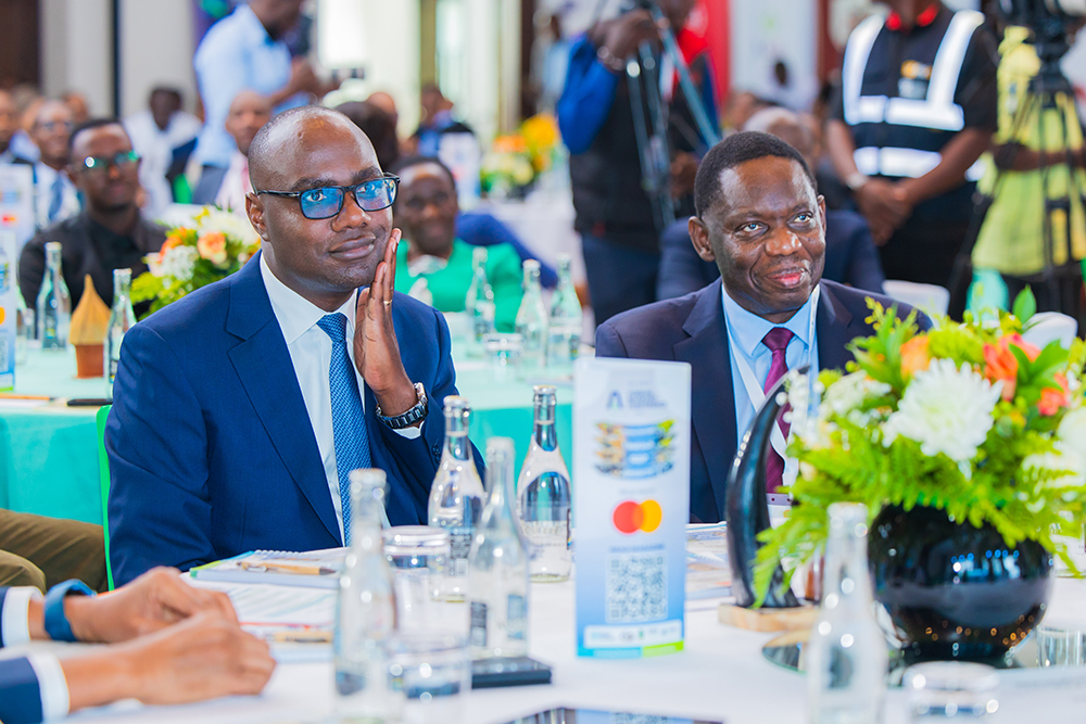Finance Minister Henry Musasizi (left) and Bank of Uganda Governor Michael Atingi-Ego during the conference