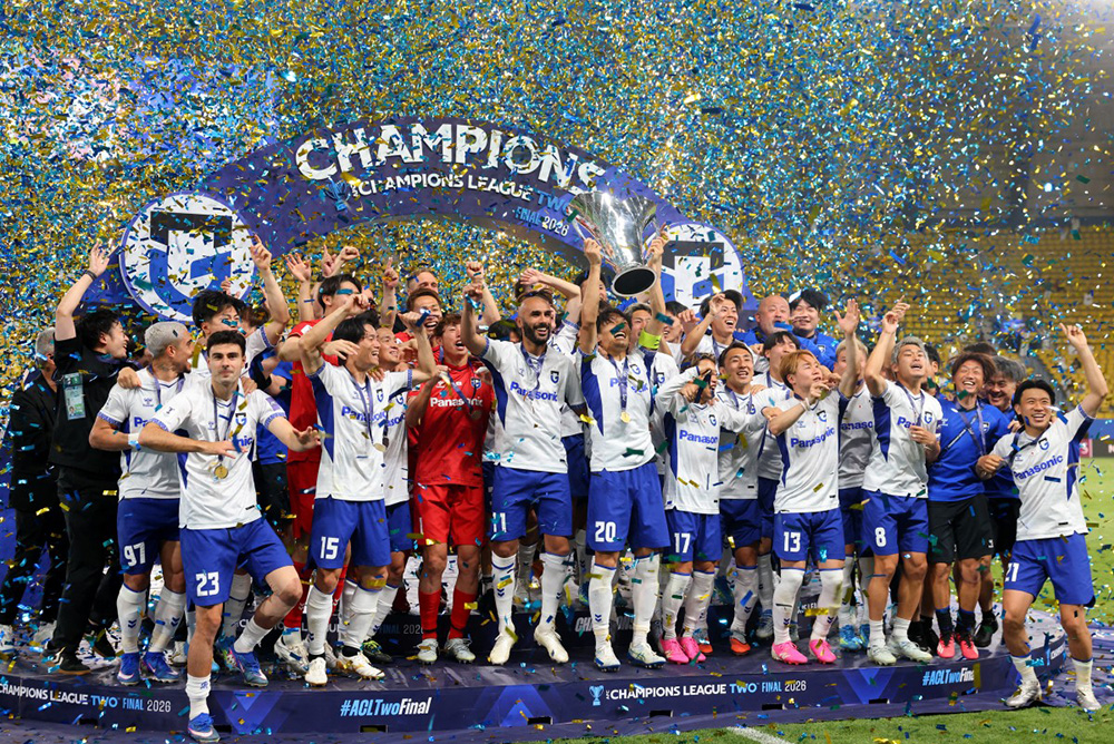 Gamba Osaka's players pose with the trophy after winning the 2026 AFC Champions League Two final football match between Al-Nassr and Gamba Osaka at the Al-Awwal Park Stadium in Riyadh on May 16, 2026. (Photo by Fayez NURELDINE / AFP)