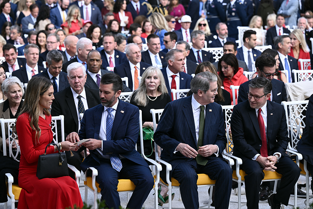 US House Speaker Mike Johnson (R), Treasury Secretary Scott Bessent (2nd R), Donald Trump Jr. (2nd L) and his girlfriend Bettina Anderson attend a Medal of Freedom Ceremony for late US right-wing political activist Charlie Kirk in the Rose Garden of the White House in Washington, DC, on October 14, 2025. Kirk was shot dead on a Utah college campus on September 10, 2025, sparking a wave of grief among conservatives, and threats of a clampdown on the "radical left" from President Donald Trump.