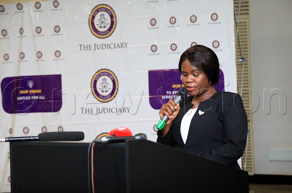 Acting Chief Registrar, Pamela Lamunu Ocaya speaking during the official handover of Chief Justice Alfonse Owiny-Dollo. (Photo by David Lukiiza)
