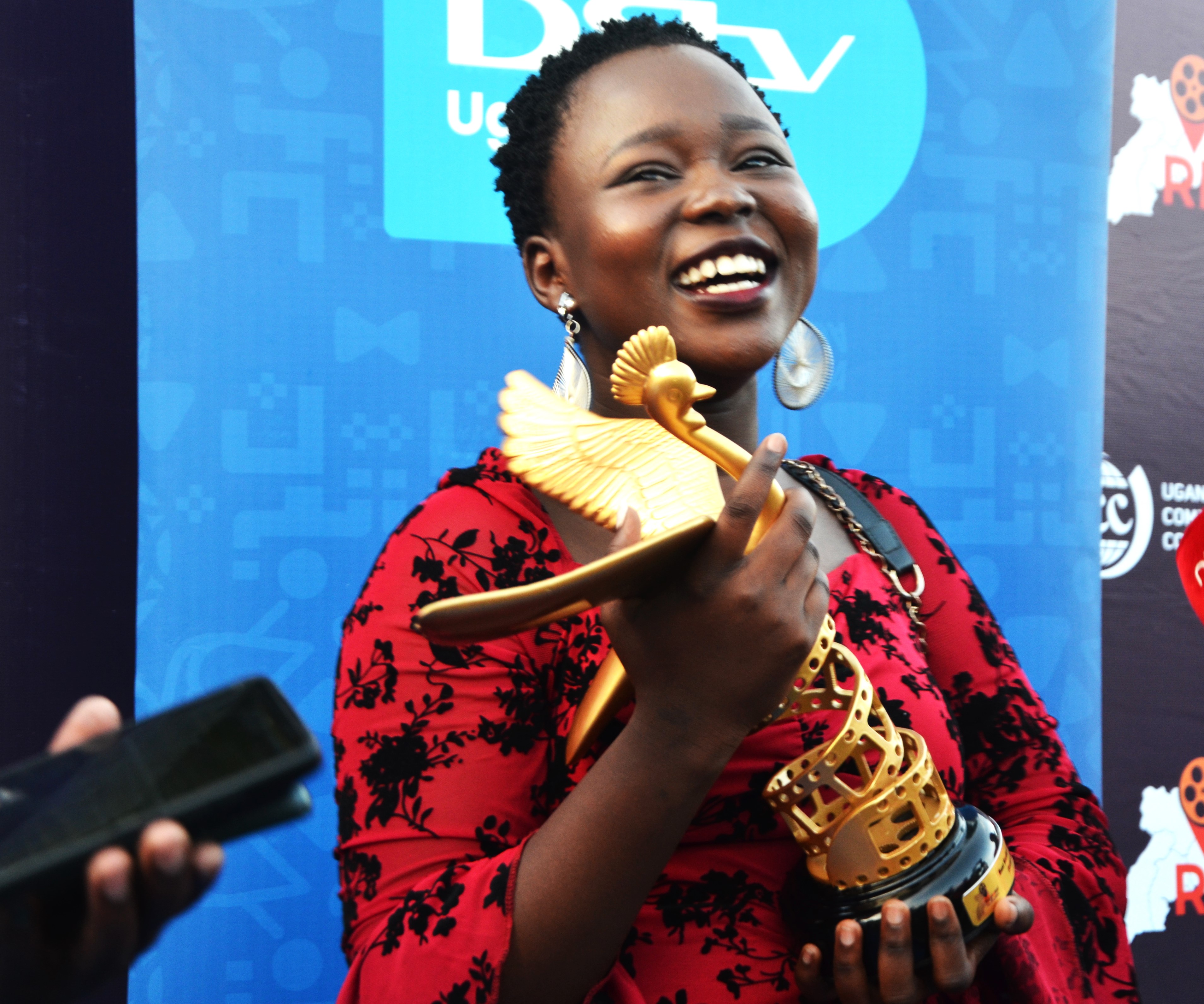 Mercy Ajibo Ejau,one of the winners celebrating with her trophy. 