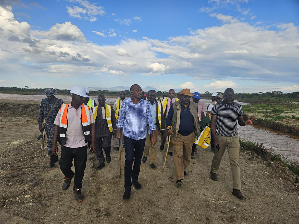 Tumwebaze accompanied by the PS MAAIF, Kasura Kyomukama, also accompanied by some Karamoja leaders touring the irrigation dam. (Courtesy)