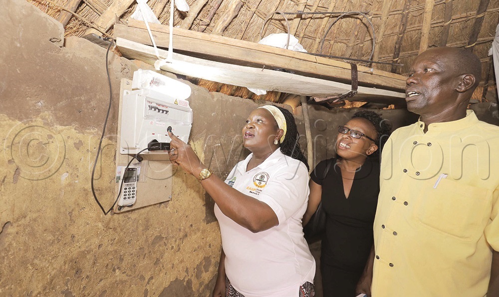 Energy minister Ruth Nankabirwa switching on a light bulb during the launch of Electricity Access Scale-up Project in Katakwi in February 2024.