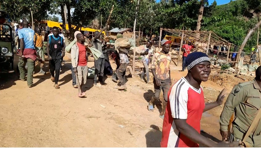 Some of artisan miners leaving one of the illegal gold mines after it was shut down. (Courtesy photo)