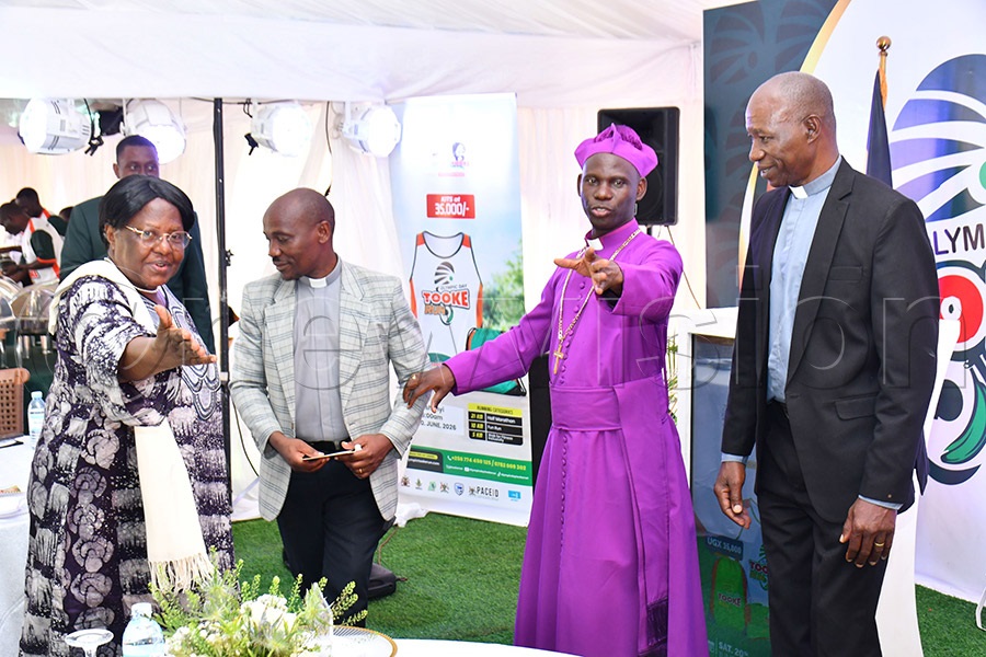 The Director General of PIBID-BIRDC and freshly designated Uganda Olympic Committee (UOC) Nutrition Ambassador, Rev. Prof. Florence Isabirye Muranga (L) chatting with Busoga Diocesan Bishop Rt. Rev. Prof. Grace Lubaale (2nd R) as Rev. Daniel Wandera (2nd L) the Bishop's Chaplain and Charles Irongo (R) the Busoga Diocesan Treasurer look on during the Olympic Day-Tooke Run breakfast meeting at the PIBID-BIRDC offices in Bukaya, Njeru Municipality in Buikwe district on May 22nd. Photo by Donald Kiirya.