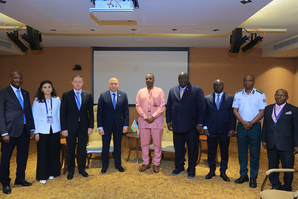 Ugandan and Azerbaijani officials take a group picture after the ceremony.