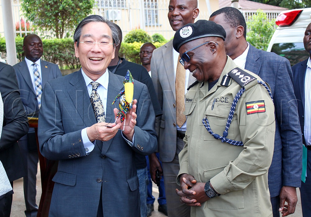 Takuya Sasayama, Ambassador of Japan to Uganda, shares a light moment with Abbas Byakagaba, Inspector General of Uganda Police, at the event in Kampala on Tuesday, May 5, 2026. (Photo by Bridget Ahurira)