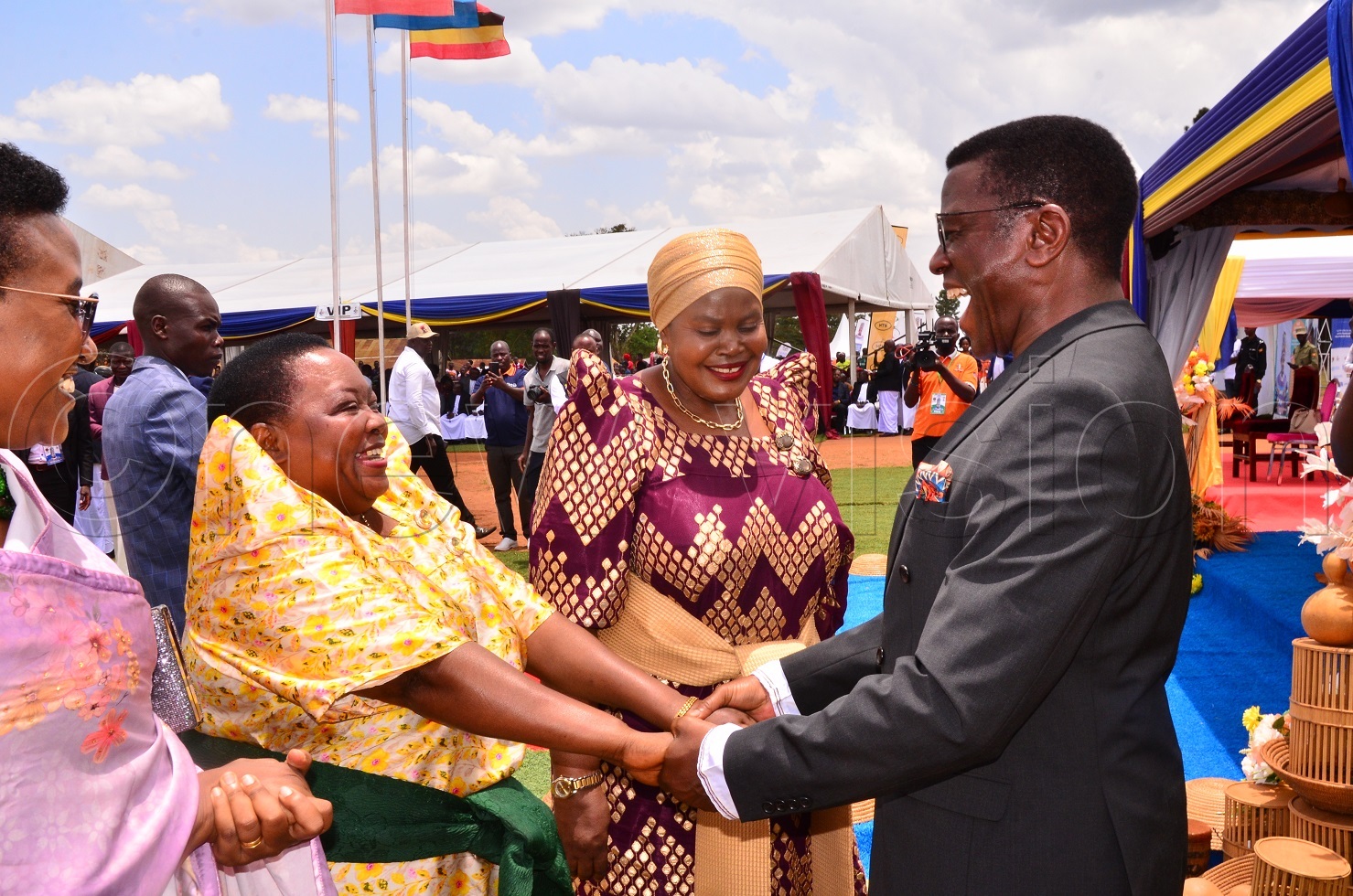 Buganda Kingdom Premier Charles Peter Mayiga welcomes Prime Minister Robinah Nabbanja as 3rd Deputy Prime Minister Rukia Nakadama (centre) looks on during the 12th Kyabazinga coronation anniversary celebrations in Mayuge district on Saturday. (Photo by Jackie Nambogga)