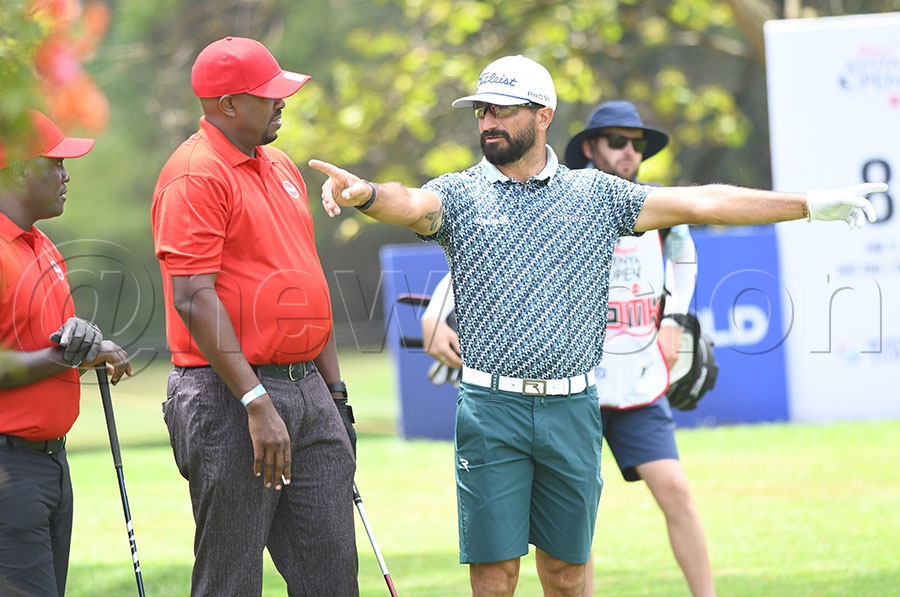 French professional Francesco Laporta passes on tips to Kenneth Tumusiime and Darwin Angudri during the MKO Pro-Am tournament at the Karen Golf Club. Photo by Michael Nsubuga