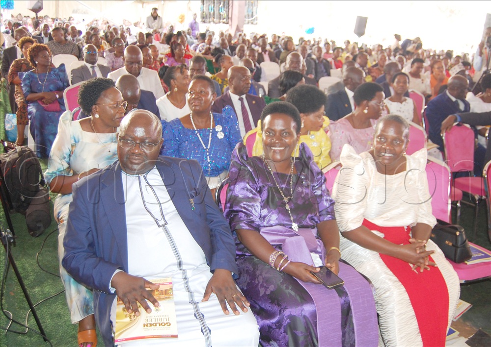 The head of the laity of Kampala archdiocese, Emily Kitto Mwaka (centre) with other Christians during mass.