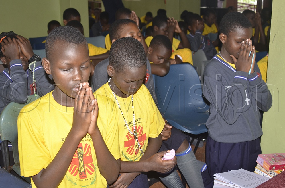 Primary Five pupils, who served as choir members, recite prayers during a special Mass at St Anthony Primary School, Kajjansi, on Saturday, October 17, 2026. (PHOTO BY JULIET ANNA LUKWAGO)