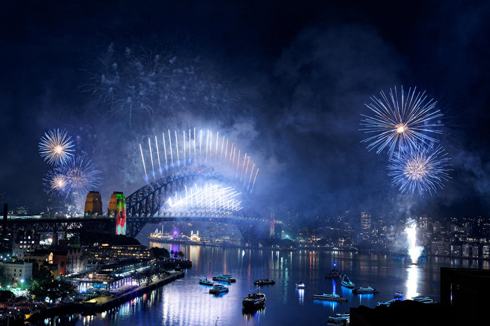 Fireworks light up the midnight sky over Sydney Harbour Bridge and Sydney Opera House during New Year&rsquo;s Day celebrations in Sydney on January 1, 2026. (AFP)