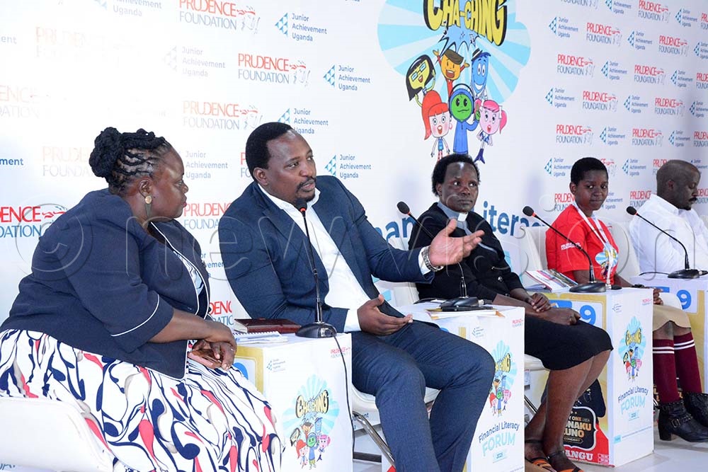 (L-R) Mary Gorret Nelima, the Headteacher Bumbobi Primary School, Mbale district, Daniel Ayebare, Chairperson, Uganda Financial Literacy Association, Rev. Anne Cherotwo, Principal, Ndegeya Core Primary Teachers College, Nampa Desire, a Pupil of Munyonyo church of Uganda, and Peter Andrew Mugarura, headmarketing and Communication at Prudential Uganda, during the invitation to cover the launch of the Cha-ching financial literacy program on September 3, 2025. (Credit: Mary Kansiime) 