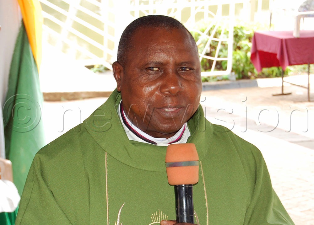 Msgr. John Waynand Katende delivers his homily during the thanksgiving mass for the 30th anniversary of the Catholic Men's Guild in Kampala Archdiocese at the Uganda Martyrs Catholic Shrine, Namugongo, in Wakiso district on Sunday, November 16, 2025. (Photo by Mathias Mazinga)