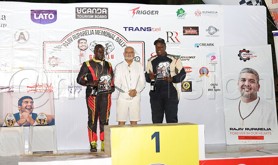 Sudir Ruparelia (C) after awarding  Ronald Sebuguzi (R) and Anthony Mugabwa their plaques for emerging second overall in the CMC Rajiv Ruparelia Memorial Rally  at Acholi in Gulu City. PHOTO: Johnson Were