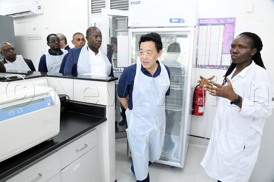 Dr Susan Kerfua (right) explaining to FAO director general Dr Qu Dongyu (left)as the team toured the laboratories at the facility.