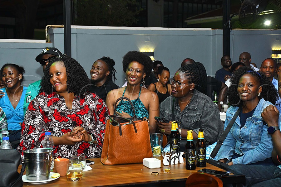 Fans enjoying The Mith's Bali Okwabwe album. Photo by Ignatius Kamya