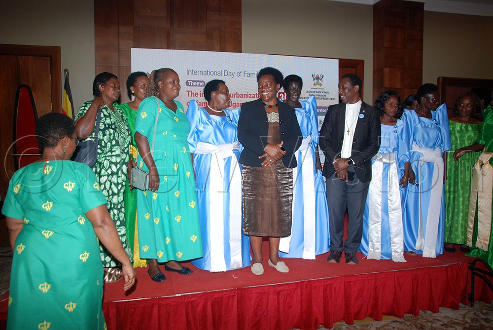 Peace Mutuzo (centre), State Minister of Gender, Labour and Social Development (MoGLSD) poses for a group photo with members of the Christian Women Fellowship after launching the National standards for parenting programs in Uganda at Sheraton Hotel on July 30, 2025. (Photo by Wilfred Sanya)