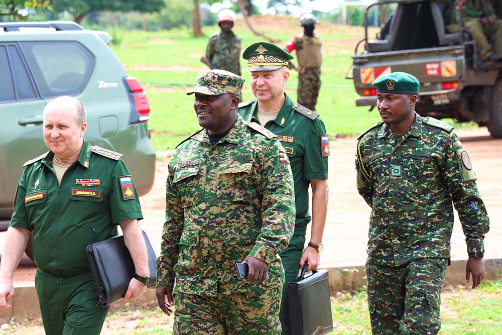 Col Vitaly Dimenko (front-left), head of the Russian delegation and right, Lt Col Richard Ssejemba, the Chief Instructor at SODIS plus offices arrive at the School of Defence Intelligence and Security (SODIS) in Migeera, Nakasongola District on March 26 2026. (Courtesy Photo)