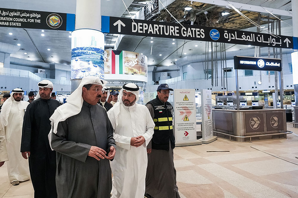 Kuwaiti Prime Minister Sheikh Ahmad al-Abdullah al-Sabah (L) visiting the international airport on March 1 after it was hit by a reported Iranian strike in Kuwait City. (AFP/Kuwaiti news agency KUNA)