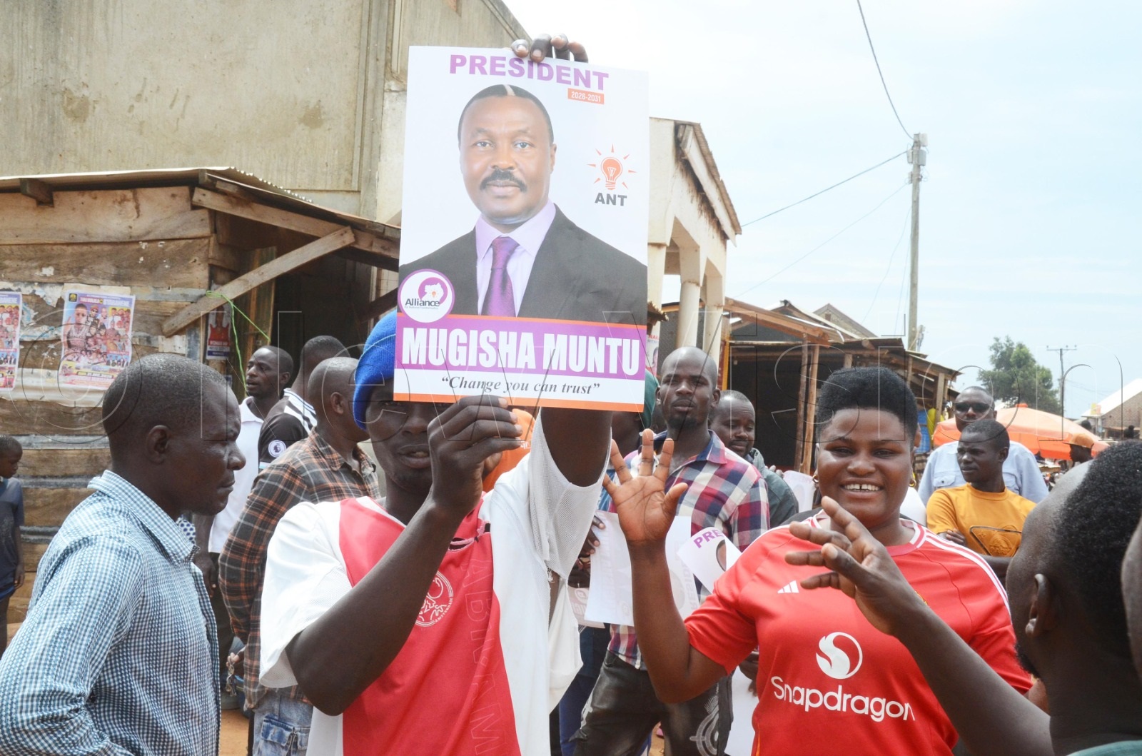 An ANT supporter displaying a Muntu campaign poster.