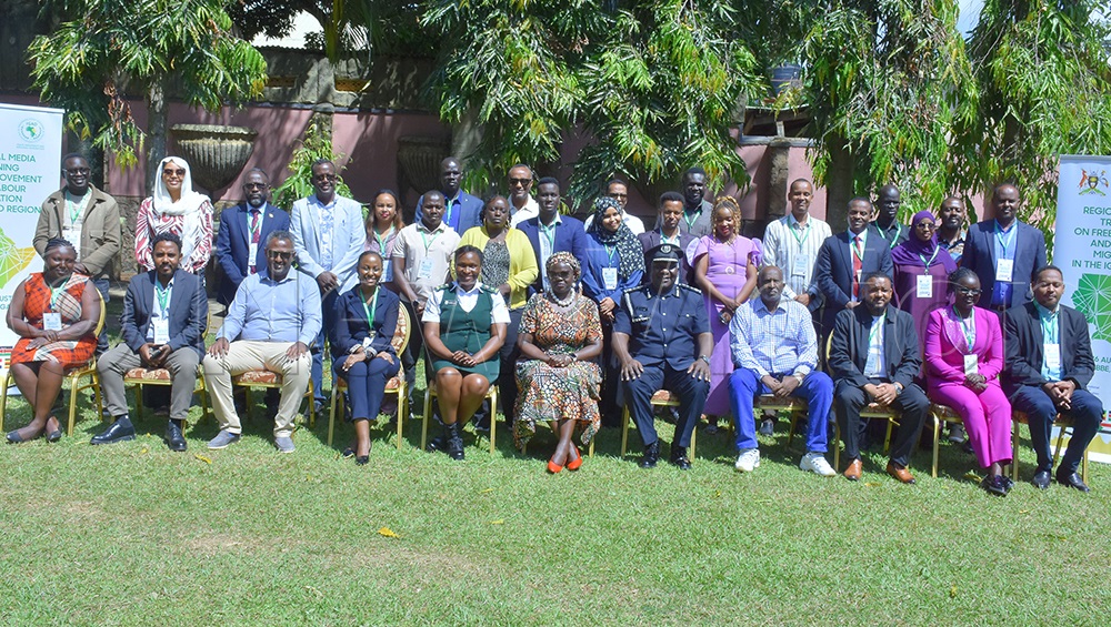Some of the journalists and government communicators from the IGAD region pose for a group photo at the close of a three-day workshop on migration reporting held in Entebbe. (Photo by Julius Luwemba).