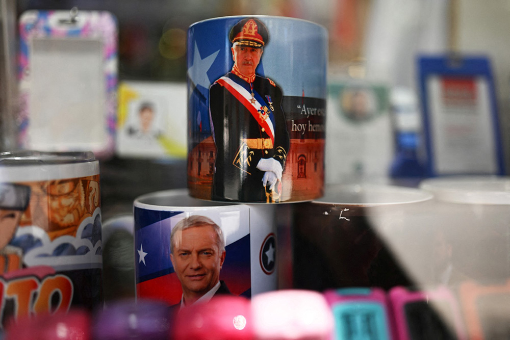 This view shows mugs with images of presidential candidate Jose Antonio Kast and the late dictator (1973–1990) Augusto Pinochet, at a shop in Santiago on October 28, 2025. (Photo by RODRIGO ARANGUA / AFP)