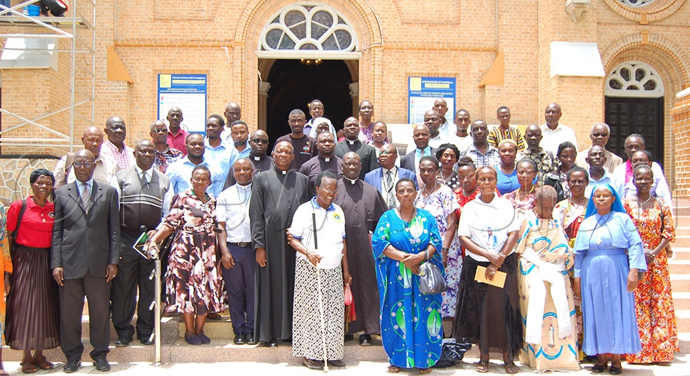 The pilgrims who donated money share a group photo moment after the function at Lubaga Cathedral on Wednesday, October 8, 2025. (Photo by Mathias Mazinga)