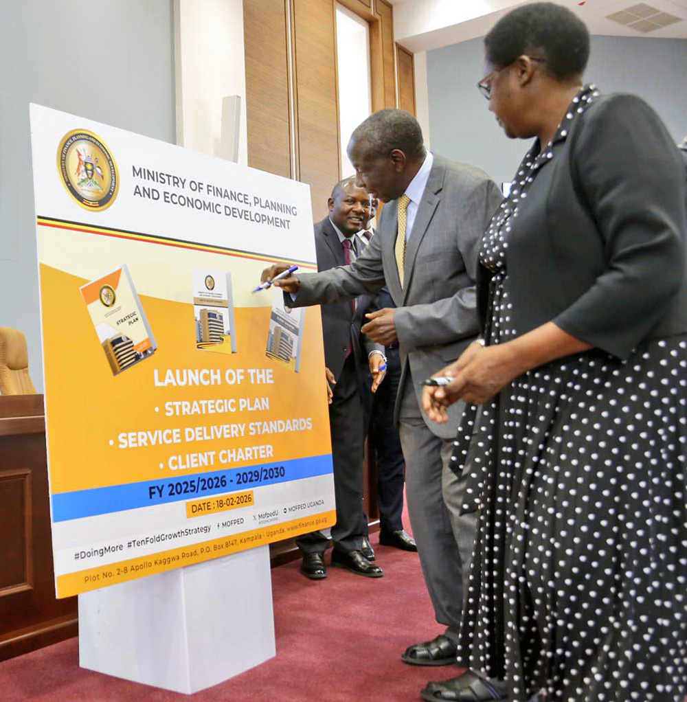 Finance Minister Matia Kasaija signing the dummy signaling the launch of the Ministry of Finance, Planning and Economic Development&rsquo;s Strategic Plan for 2025/26&ndash;2029/30, Client Charter and Service Delivery Standards. (Courtesy Photo)