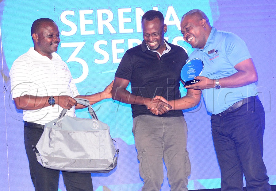 Serena's marketer William Mpungu (left) and General Manager Duncan Lewa (right) present prizes to Timothy Musiime who was the runners up in the subsidiary event. Photo by Michael Nsubuga