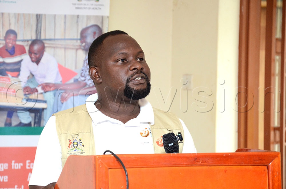Dr Amos Wambete, the Kalangala cluster coordinator for the Heroes for Gender Transformative Action Program addressing during the programme's close-out event at the district headquarters recently. (Credit: Lawrence Mulondo)