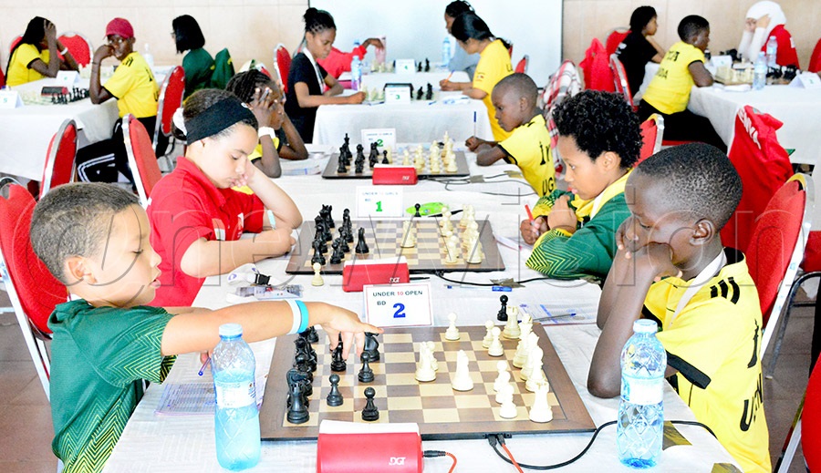 South African Tristan Arries (left) takes on Uganda's Elvis Tumusiime (right) during during the Africa Youth Chess Championship at the Imperial Botanical Beach Hotel, May 20, 2026. Photo by Michael Nsubuga