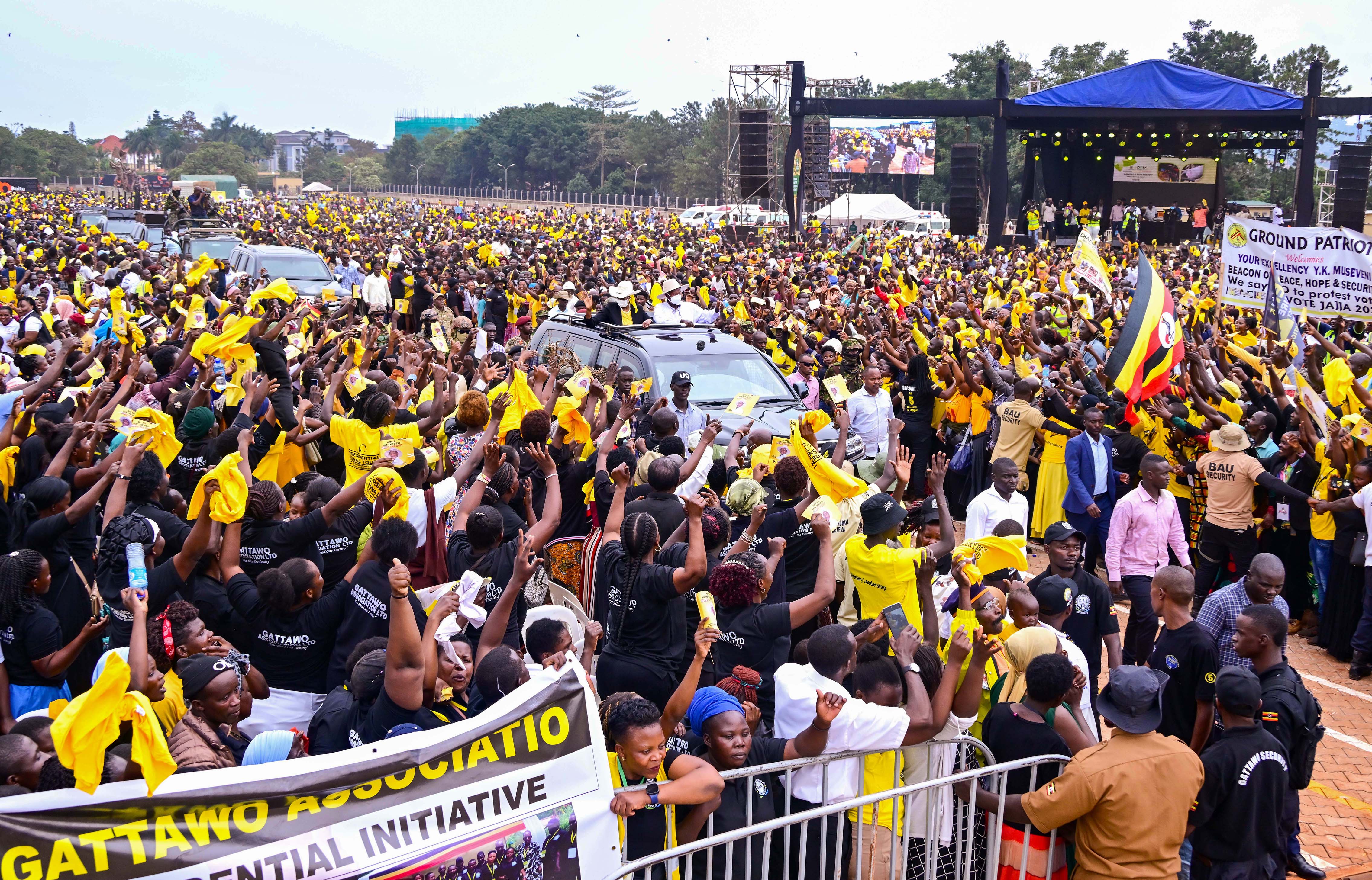 President Museveni, accompanied by First Lady Janet Kataha Museveni, waves to the masses as he arrives at Kololo ceremonial grounds to address a PDM rally for Kampala on Sunday, July 20th.
