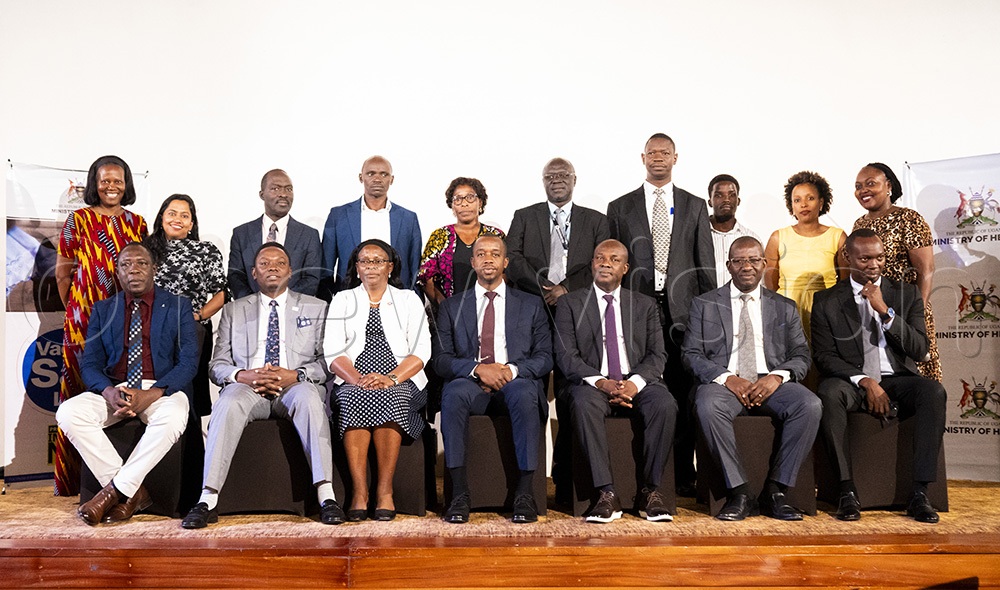Minister Charles Ayume in the centre takes a group photo with other health stakeholders during the measles vaccination high-level engagement at Kabira Country Club. (Photo by John Musenze)