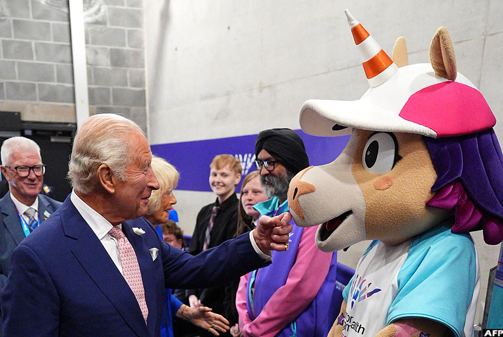 Britain's King Charles III meets Finnie, the 2026 Commonwealth Games unicorn mascot at the OVO Arena in Glasgow, Scotland, on July 23, 2026