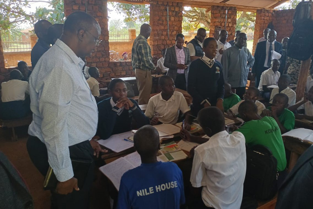 The visiting delegation listening to some of the learners during there visit to assess service provision at St Stephen Secondary School in Budondo in Jinja city. (Photo by Doreen Musingo) 
