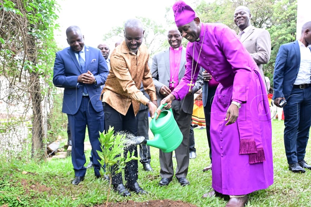 Deputy Speaker Thomas Tayebwa and the Archbishop Dr Samuel Stephen Kaziimba Mugalu watering the planted tree.