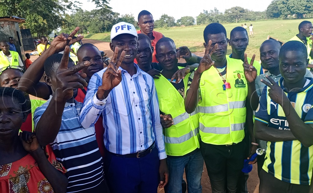 PFF's Shadrack Odoi, wearing a blue and white striped shirt and PFF cap, is seen with his supporters at Kidoko, where he launched a door-to-door campaign on Monday, November 10, 2025. (Photo by George Ofwono)