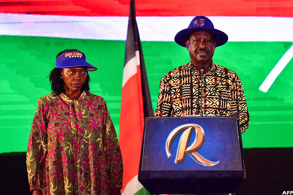 On August 16, 2022, Kenya's defeated presidential candidate Raila Odinga (R) speaks during a press conference, flanked by his running mate Martha Karua (L), at KICC in Nairobi
