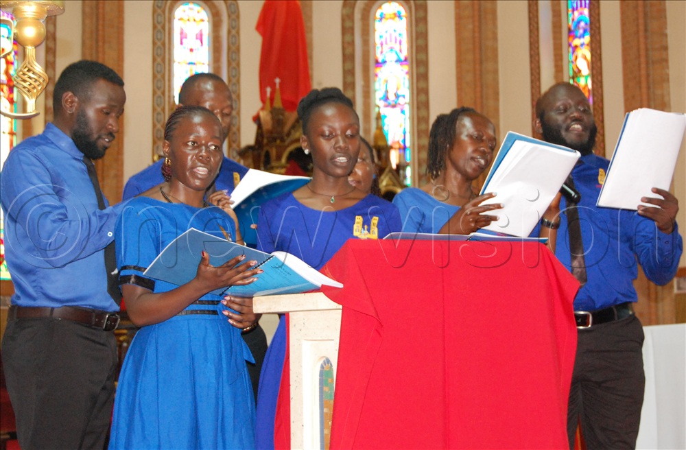 The youthful  members of St. Genesius Choir participating in the reading of the long Gospel of the Passion of Christ during the Palm Sunday Mass at Lubaga Cathedral.