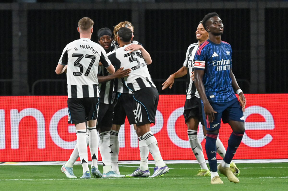 Newcastle's Anthony Elanga (C) celebrates with teammates after scoring their first goal during the Singapore Festival of Football pre-season friendly match between Arsenal and Newcastle United at the National Stadium in Singapore on July 27, 2025. 
