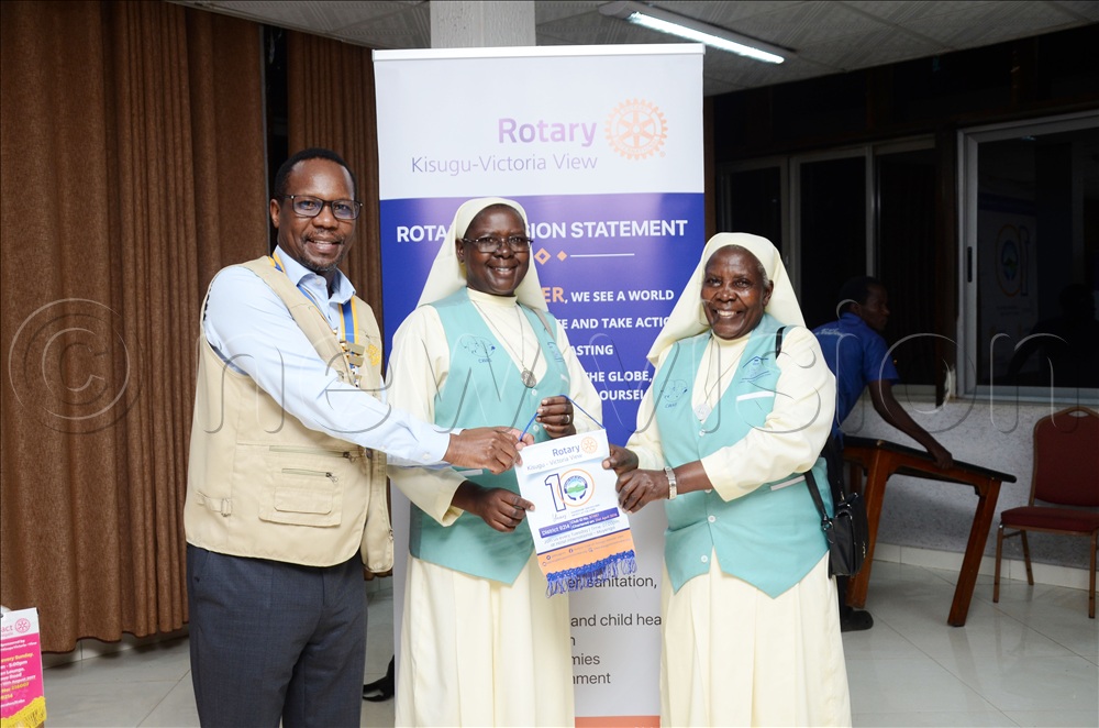 Bernard Tabaire (extreme Left), the Rotary Club of Kisugu Victoria View President, handing sisters from Nsambya Babies’ Home a Rotary badge during the inaugural fellowship of the Rotary Club of Kisugu Victoria View for the 2026/2027 Rotary year at Hotel International Muyenga in Kampala on July 07, 2026.
