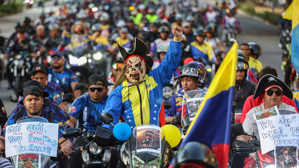 Motorcyclists supporting Venezuelan President Nicolas Maduro take part in a motorcade to protest against the United States in Caracas on December 22, 2025. (Credit: AFP)