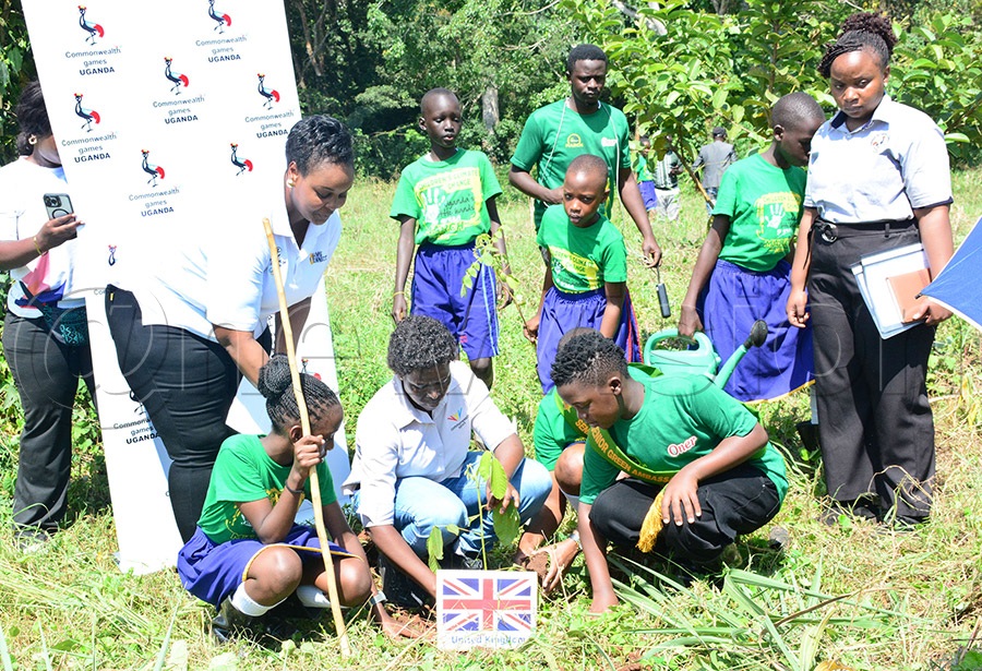 Commonwealth Games Association of Uganda's Beatrice Ayikoru and Anne Mungoma and some children plants a tree for the United Kingdom at Najjembe in Mabira Forest, June 4, 2026. Photo by Michael Nsubuga